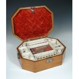 An early 19th century Indo-French satinwood work box, the canted rectangular hinged lid with