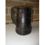 An 18th century Scandinavian lacquered wood lidded tankard, the coopered wood sides black