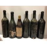 Older unknown wines. 12 bottles of different shapes, one labelled for 'Savoy Hotel Carafe Wines