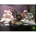 Five ceramics including a Zolnay girl with swan, Russian lady, a boy with chicken, Italian 'Making