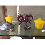 A pair of Peking yellow glass bowls and covers, a Yixing tea pot and three wood stands
