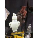 A 'jade' two handled vase and cover, a soapstone vase and a seal (3) Dog on lid is chipped, Jade has