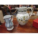 EG. A pearlware 'Mrs Copeman Blyboro' jug (damaged) together with a maiolica jug