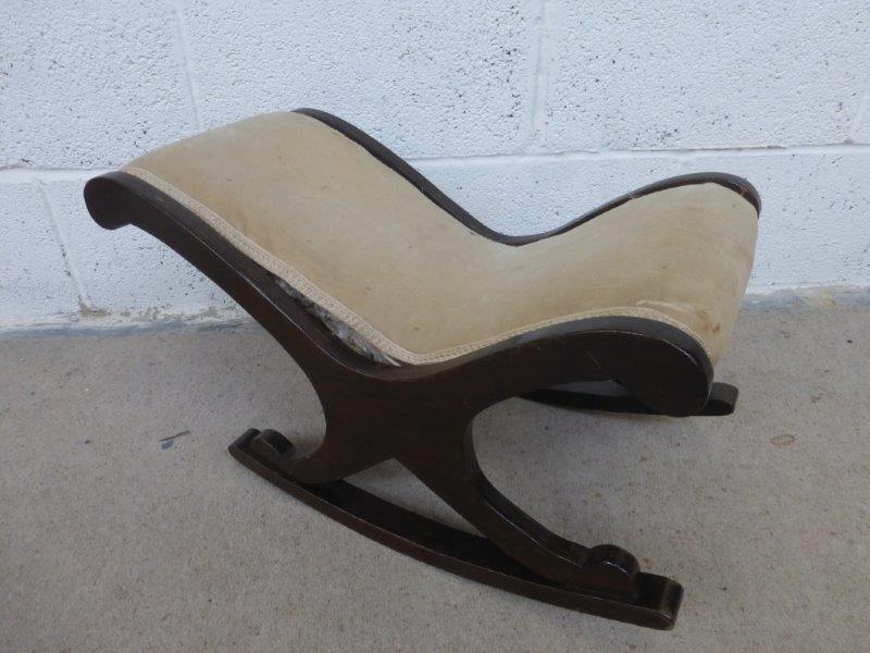 An early 20th Century gout stool with rocking base.