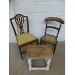 An oak stool with painted base and two chairs.