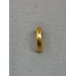 A 22ct gold wedding band, 7.77g.