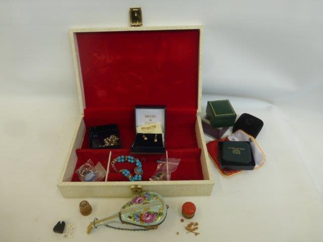 A jewellery box with an assortment of gold, silver and costume jewellery, also a Viking Whitby jet