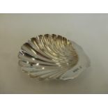 A silver shell shaped trinket dish, maker James Deakin & Sons, Sheffield 1897.