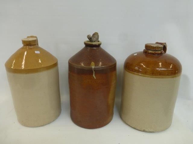 Three assorted stoneware flagons, unnamed, one with an oak tap.