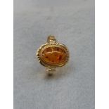 A 14ct gold and amber ring stamped 585, size S.