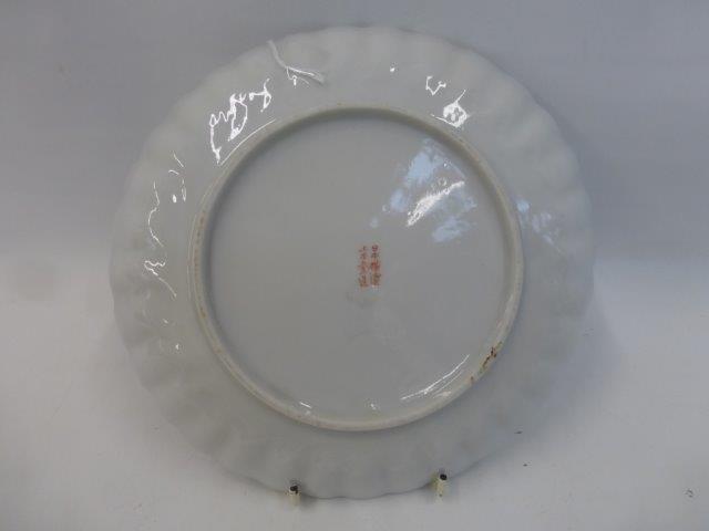 A 19th Century Japanese Satsuma ribbed dish decorated with Mount Fuji and a village in the forefont, - Image 2 of 2