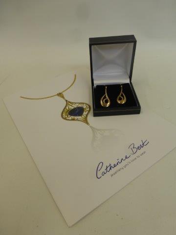 A pair of Catherine Best 9ct gold drop earrings with a certificate of authenticity.