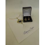 A pair of Catherine Best 9ct gold drop earrings with a certificate of authenticity.