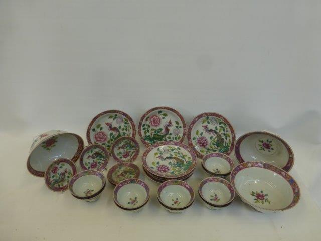 A Chinese Famille Rose decorated part dinner service, comprising twenty-five pieces, character marks