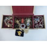 An assortment of costume jewellery including a bird brooch, Art Deco, necklaces etc.