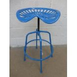 A revolving tractor seat stool.