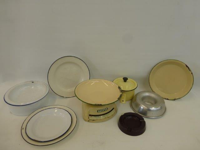 An assortment of enamelled kitchenalia.