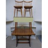 A 1950s formica topped drop flap kitchen table and two chairs, a 1940s oak draw leaf kitchen table