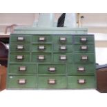 A stained pine bank of eighteen drawers, (tool drawers).