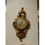A carved gilt wood acanthus framed wall clock stamped All British Clocks to the movement.
