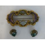 A Victorian brooch set with moon shaped amethysts and a pair of early 20th Century clip on