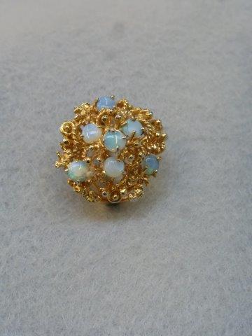 A white gold and yellow gold (unmarked) seven stone opal cluster dress ring, size M/N.