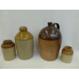 An assortment of stoneware jars and a large salt glazed flagon.