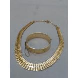 A 9ct gold and bronze core bracelet with engine turned decoration and an Egyptian style gilt