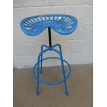 A revolving tractor seat stool.