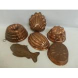Six assorted copper jelly moulds of various forms.