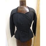 A Mattli black well structured suit with unusual fringe detail to the back, with pencil skirt, in