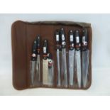 A Waltmann und Sohn nine piece knife set in a carrying roll bag.