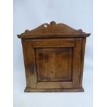 A 19th Century fruitwood and pine single door cabinet.