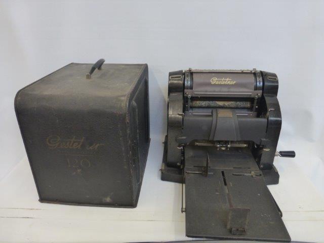 An early 20th Century Gestetner copying machine with metal cover.