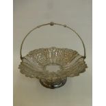 An early 20th Century silver plated pedestal fruit basket with embossed and pierced decoration