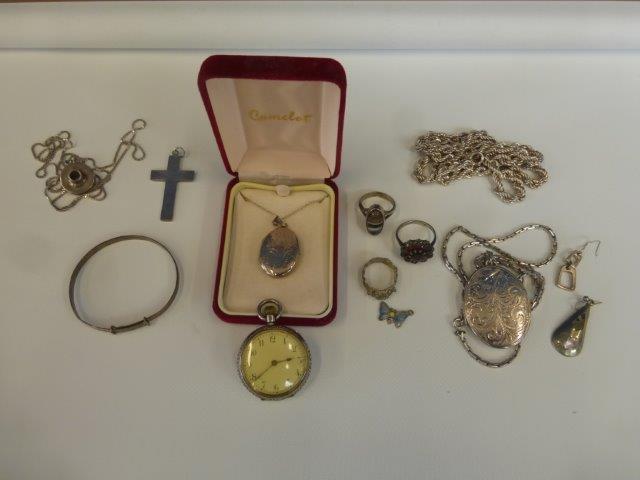 An assortment of silver jewellery including two lockets with chains.