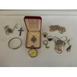 An assortment of silver jewellery including two lockets with chains.