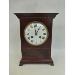 An inlaid mahogany eight day mantle clock with a white enamel face, stamped L.P. Japy & Co. 1878