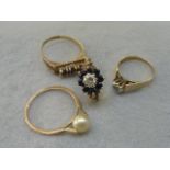 Four assorted 9ct gold rings set with sapphires, garnets, diamonds etc.