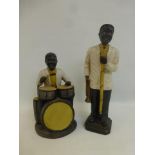 A pair of pottery jazz players.