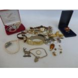 An assortment of costume jewellery including some silver and gold.