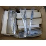 Twenty boxes of unused flatware.