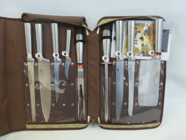 A Waltmann und Sohn cased nine piece knife set.