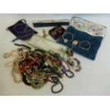 An assortment of costume jewellery including wristwatches etc.