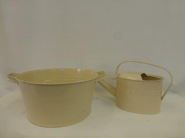 A painted metal watering can and a similar twin handled tub.