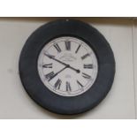A large novelty circular battery operated wall clock.