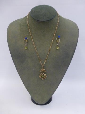 A 9ct gold late 19th Century diamond, peridot and seed pearl pendant necklace with matching drop