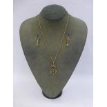 A 9ct gold late 19th Century diamond, peridot and seed pearl pendant necklace with matching drop