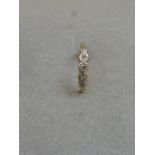 An 18ct gold and platinum set five stone diamond ring, size O.