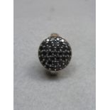 A silver and black diamond cluster dress ring, size O.